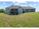 Expansive backyard view of home featuring deck and walkout basement at 9083 W Koger Ln, Martinsville, IN 46151