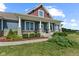Inviting single-story home features stone accents, columns, and a cozy front porch at 9083 W Koger Ln, Martinsville, IN 46151