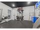 Home gym with fitness equipment, drop ceiling, and open floor plan at 9083 W Koger Ln, Martinsville, IN 46151