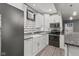 Well-equipped kitchen with white cabinets, granite counters, stainless steel appliances at 9083 W Koger Ln, Martinsville, IN 46151
