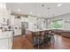 The kitchen features a large island, stainless-steel appliances, and a view into the Gathering room at 9083 W Koger Ln, Martinsville, IN 46151