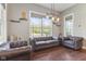 Cozy living room with hardwood floors, a large window, and stylish, leather furniture at 9083 W Koger Ln, Martinsville, IN 46151