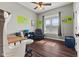 Bright office space with hardwood flooring, a large window, and a comfortable chair at 9083 W Koger Ln, Martinsville, IN 46151