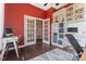 Office space with built-in shelving, bright red walls, computer, and office desk at 9083 W Koger Ln, Martinsville, IN 46151