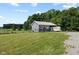 Outbuilding with attached trailer parking on expansive lawn at 9083 W Koger Ln, Martinsville, IN 46151