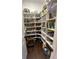 Walk-in pantry with ample shelving provides lots of storage space for pantry goods and small appliances at 9083 W Koger Ln, Martinsville, IN 46151