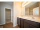 Double vanity bathroom with dark brown cabinets and a shower at 1157 Paul Revere Dr, Mooresville, IN 46158