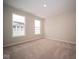 Well-lit bedroom with neutral walls and carpet flooring at 1157 Paul Revere Dr, Mooresville, IN 46158