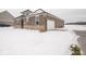 Brick home with attached garage, snow-covered yard at 1157 Paul Revere Dr, Mooresville, IN 46158