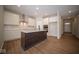 Modern kitchen with white cabinets and an island at 1157 Paul Revere Dr, Mooresville, IN 46158