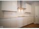 White kitchen cabinets and a gas cooktop at 1157 Paul Revere Dr, Mooresville, IN 46158