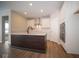 Modern kitchen with white cabinets, island, and stainless steel appliances at 1157 Paul Revere Dr, Mooresville, IN 46158