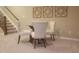 Basement dining area with a small table and chairs at 621 Greenford W Trl, Carmel, IN 46032