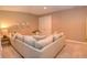 Finished basement with sectional sofa and a glass-top table at 621 Greenford W Trl, Carmel, IN 46032