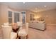 Finished basement with seating area and dining table at 621 Greenford W Trl, Carmel, IN 46032
