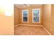 Spacious bedroom with neutral carpeting and two windows at 621 Greenford W Trl, Carmel, IN 46032