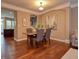 Formal dining room with hardwood floors and a view of the kitchen at 621 Greenford W Trl, Carmel, IN 46032