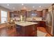 Modern kitchen with granite countertops, stainless steel appliances, and an island at 621 Greenford W Trl, Carmel, IN 46032
