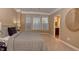 Large main bedroom with bay window and carpeted floor at 621 Greenford W Trl, Carmel, IN 46032