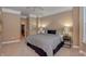 Bright main bedroom with ceiling fan and ample closet space at 621 Greenford W Trl, Carmel, IN 46032