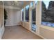 Bright screened porch with view of woods at 621 Greenford W Trl, Carmel, IN 46032