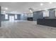 Finished basement with fireplace, kitchen cabinets, and vinyl flooring at 2101 N Wolf Cv, Martinsville, IN 46151