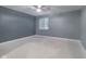 Spacious basement bedroom with gray walls and new flooring at 2101 N Wolf Cv, Martinsville, IN 46151