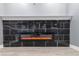 Modern electric fireplace with marble surround in finished basement at 2101 N Wolf Cv, Martinsville, IN 46151