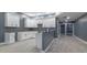 Unfinished basement kitchen with white cabinets and gray walls at 2101 N Wolf Cv, Martinsville, IN 46151