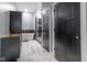 Spa-like bathroom with freestanding tub, walk-in shower, and dark vanity at 2101 N Wolf Cv, Martinsville, IN 46151