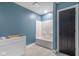 Simple bathroom with a tub/shower combo, white vanity, and gray walls at 2101 N Wolf Cv, Martinsville, IN 46151