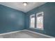 Bright bedroom with two windows, neutral walls, and hardwood floors at 2101 N Wolf Cv, Martinsville, IN 46151