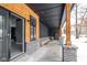 Covered porch with access to the lower level, featuring a sliding glass door at 2101 N Wolf Cv, Martinsville, IN 46151