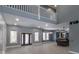 Open floor plan boasts high ceilings, modern kitchen, and spacious living area at 2101 N Wolf Cv, Martinsville, IN 46151