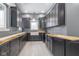 Newly constructed kitchen with dark shaker cabinets and farmhouse sink at 2101 N Wolf Cv, Martinsville, IN 46151