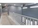 Open loft area overlooking main living space with white railing at 2101 N Wolf Cv, Martinsville, IN 46151