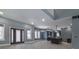 Open concept living and kitchen area with dark cabinetry and island at 2101 N Wolf Cv, Martinsville, IN 46151