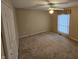 Bright bedroom with ceiling fan and neutral carpeting at 14 Winchester Ct, Anderson, IN 46013