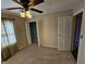 Spacious bedroom with ceiling fan, large closet, and neutral walls at 14 Winchester Ct, Anderson, IN 46013