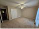 Bright bedroom with ceiling fan and neutral carpeting at 14 Winchester Ct, Anderson, IN 46013