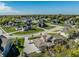 An aerial view of a residential neighborhood with well-manicured lawns and tree-lined streets at 340 Beechwood Farm Ln, Indianapolis, IN 46260