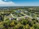 Stunning aerial view of a neighborhood with mature trees, manicured lawns, and a tranquil pond at 340 Beechwood Farm Ln, Indianapolis, IN 46260