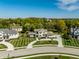 Panoramic aerial view of a home with lush greenery and a well-designed driveway at 340 Beechwood Farm Ln, Indianapolis, IN 46260