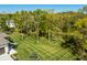 Picture of a spacious and beautiful backyard, surrounded by many tall, mature trees at 340 Beechwood Farm Ln, Indianapolis, IN 46260