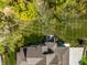 A stunning aerial view shows a huge back yard lined with mature trees at 340 Beechwood Farm Ln, Indianapolis, IN 46260