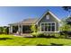 Spacious backyard features a lush lawn, patio, and a metal elephant sculpture as a focal point at 340 Beechwood Farm Ln, Indianapolis, IN 46260