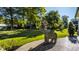 Manicured backyard with a metal elephant sculpture on the concrete patio at 340 Beechwood Farm Ln, Indianapolis, IN 46260