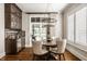Charming dining room with natural light, stylish light fixture, and elegant furnishings at 340 Beechwood Farm Ln, Indianapolis, IN 46260