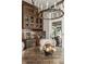 Inviting dining room featuring stylish light fixture, a view to the backyard and custom bar area at 340 Beechwood Farm Ln, Indianapolis, IN 46260