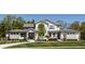 Attractive two-story residence with a well-kept lawn, a circular driveway, and inviting curb appeal at 340 Beechwood Farm Ln, Indianapolis, IN 46260